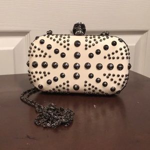 Skull studded pleather hard shell clutch